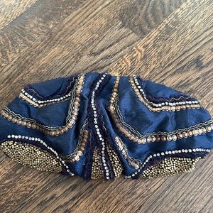 Sequined Cloud clutch.